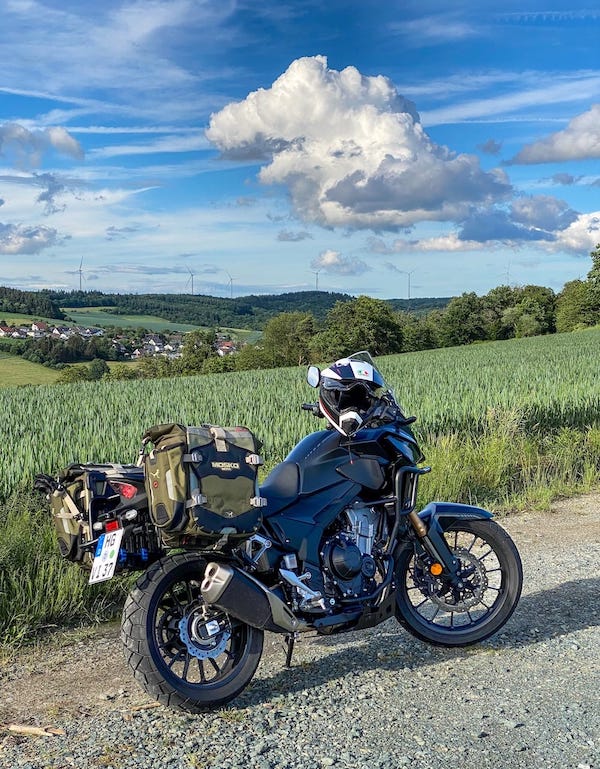 A packed motorbike on a gravel road in Germany